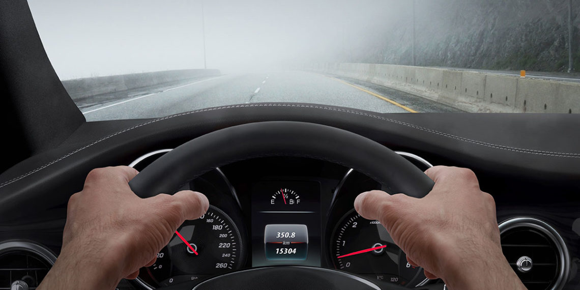 Car with clear a foggy windshield