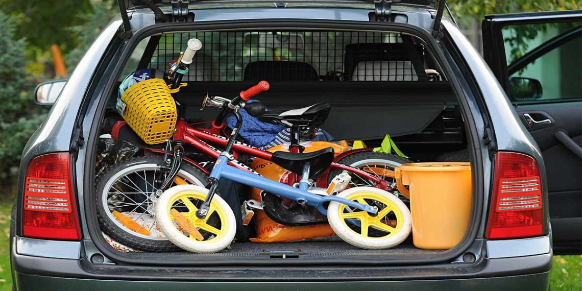 hatchback trunk with children's bicycles and storage bins