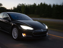 Tesla driving at dusk